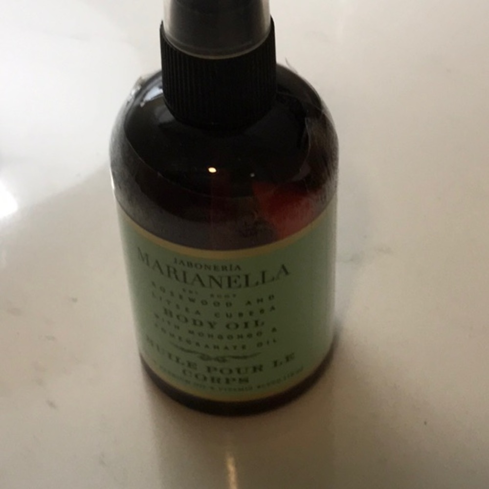 Marianella body oil, never opened .